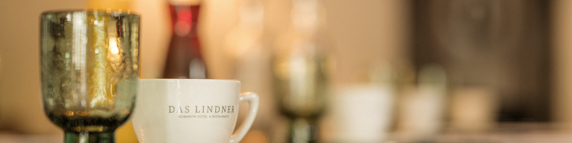 Bild einer Kaffeetasse mit der Aufschrift "Das Lindner"